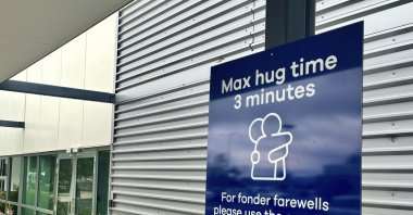 A sign outlining time limits for visitors to the passenger drop-off area outside Dunedin Airport, Momona, New Zealand, Oct. 22, 2024. (AP Photo)