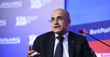 Treasury and Finance Minister Mehmet Şimşek speaks at a panel on the sidelines of the Turkish-Arab Economic Forum, Istanbul, Türkiye, Oct. 17, 2024. (AA Photo)