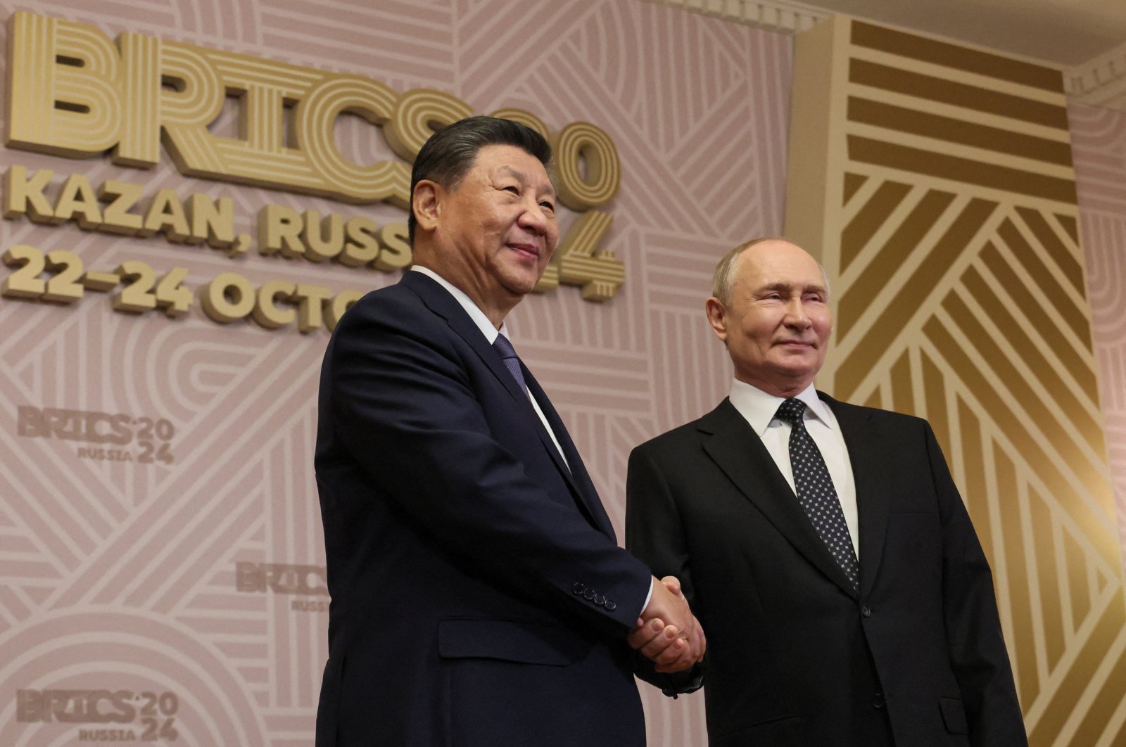 Russian President Vladimir Putin welcomes Chinese President Xi Jinping during welcoming ceremony before an informal dinner on the sidelines of the BRICS 2024 Summit in Kazan, Russia, Oct. 22, 2024. (Reuters Photo)