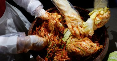 Lee Ha-yeon, a recognized kimchi grand master, and her apprentices prepare kimchi at the Kimchi Culture Institute in Namyangju, South Korea, Aug. 21, 2024. (Reuters Photo)