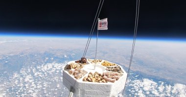 A capsule carrying nuts from Türkiye&#039;s Adana brand Bulutlar Kuruyemiş reaches space, Oct. 23, 2024. (DHA Photo)