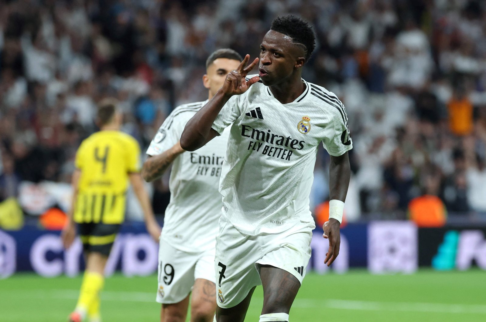 Real Madrid&#039;s Vinicius Junior celebrates scoring a hat trick and his team&#039;s fifth goal during the UEFA Champions League, league phase Day 3 football match between Real Madrid and Borussia Dortmund at the Santiago Bernabeu stadium, Madrid, Spain, Oct. 22, 2024. (AFP Photo)