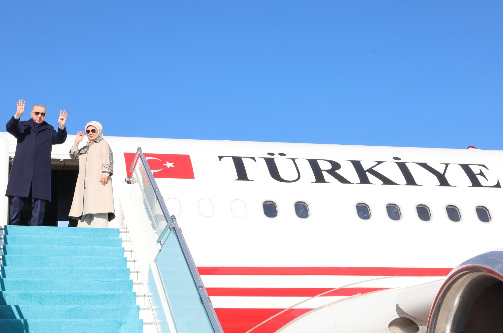 President Recep Tayyip Erdoğan and first lady Emine Erdoğan wave as they board a plane for Tatarstan, Ankara, Türkiye, Oct. 23, 2024. (AA Photo)