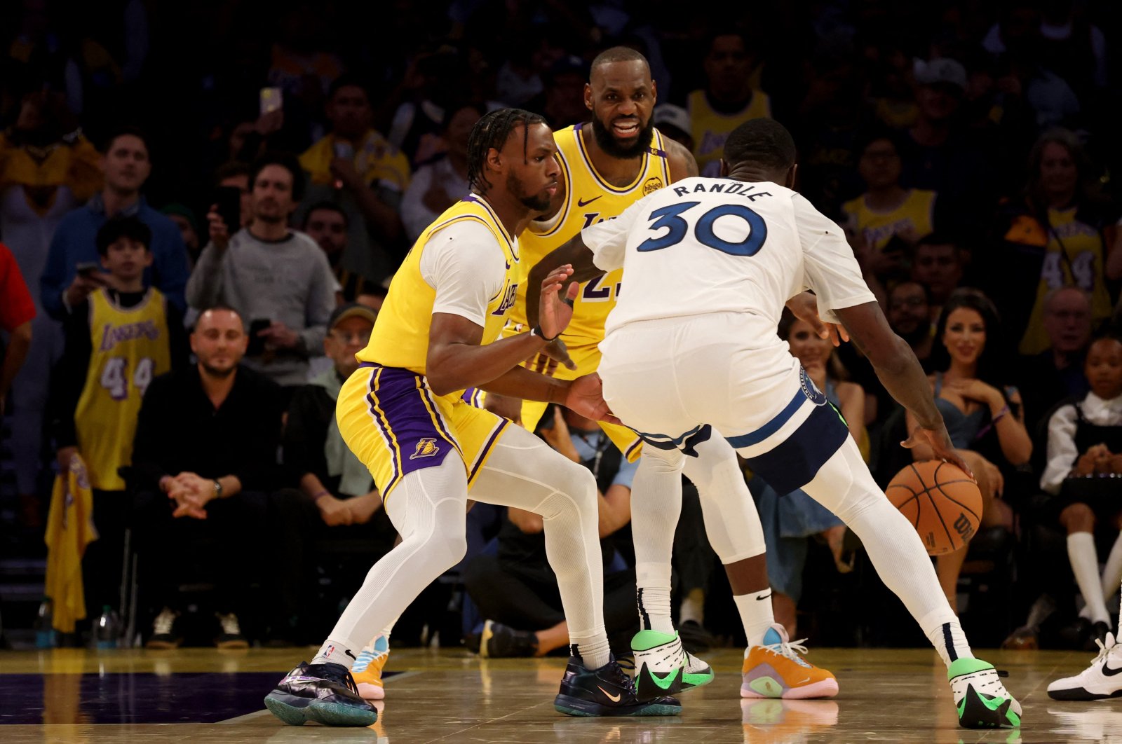 Los Angeles Lakers guard Bronny James (L) and forward LeBron James (C) guard Minnesota Timberwolves forward Julius Randle during the second quarter against the Minnesota Timberwolves at Crypto.com Arena, Los Angeles, California, U.S., Oct. 22, 2024. (Reuters Photo)