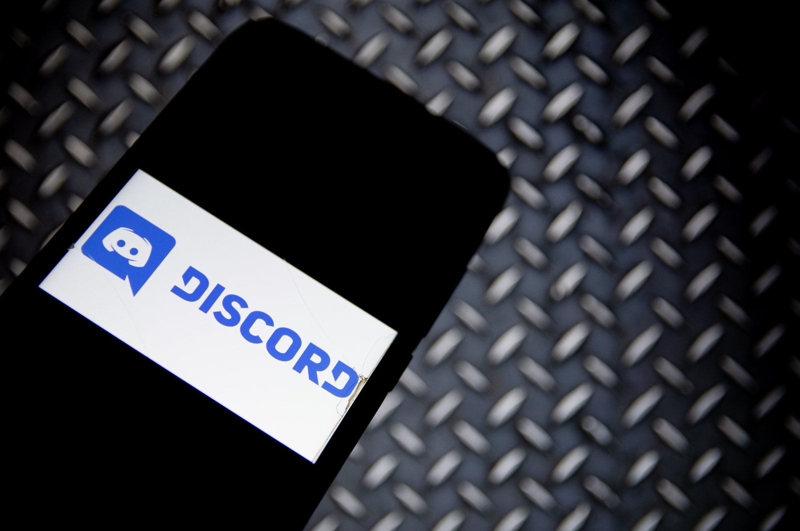 The Discord logo is displayed on a smartphone screen, Athens, Greece, April 13, 2021. (Getty Images Photo)