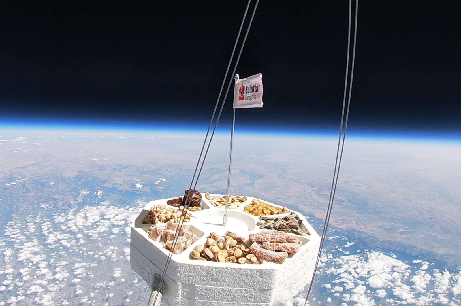 A capsule carrying nuts from Türkiye&#039;s Adana brand Bulutlar Kuruyemiş reaches space, Oct. 23, 2024. (DHA Photo)