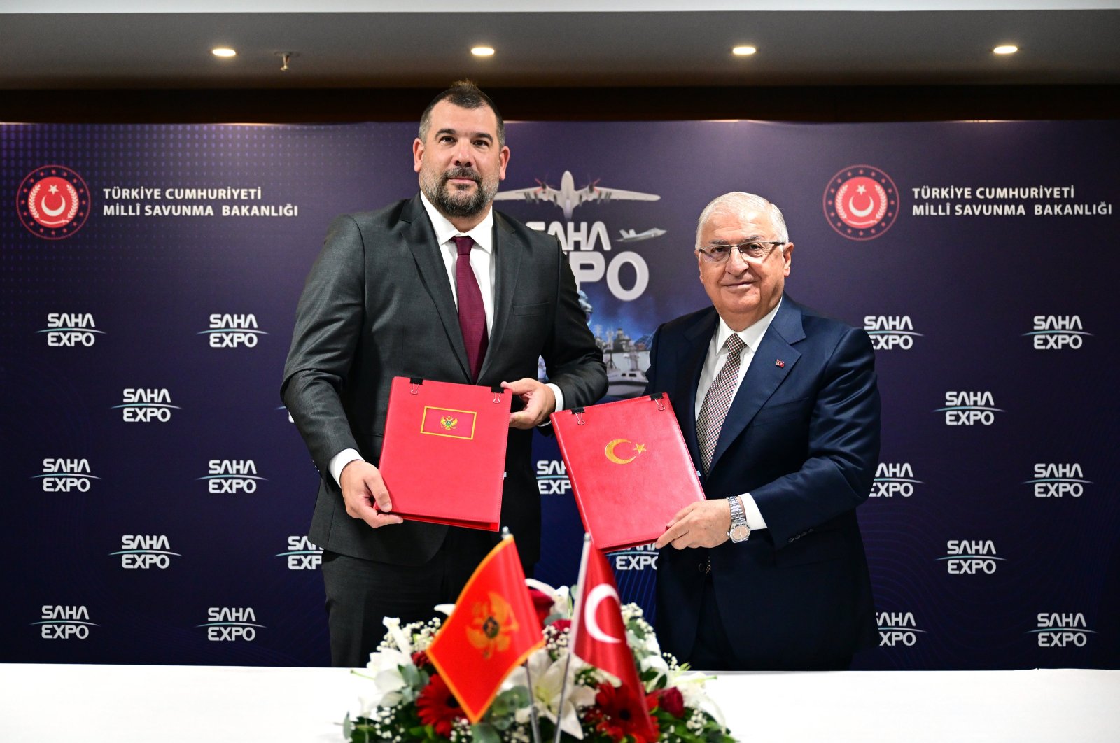 National Defense Minister Yaşar Güler (R) and his Montenegrin counterpart Dragan Krapovic sign a military health cooperation protocol at the International Defense, Aviation and Space Industry Fair (SAHA EXPO 2024) in Istanbul, Türkiye, Oct. 23, 2024. (AA Photo)