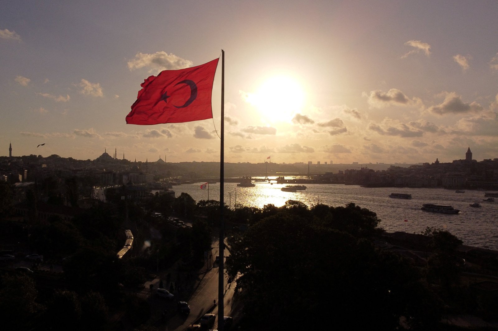 A drone view shows a Turkish flag flying over Sarayburnu with the Golden Horn in the background in Istanbul, Türkiye, June 21, 2024. (Reuters Photo)