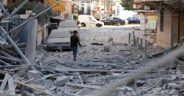 A person inspects the damage from Israeli strikes in Tyre, southern Lebanon, Oct. 23, 2024. (Reuters Photo)