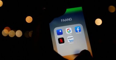 The logos of mobile apps, Google, Amazon, Facebook, Apple and Netflix, are displayed on a screen in this illustration picture taken on Dec. 3, 2019. (Reuters Photo)