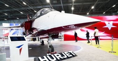 A Turkish flag is reflected on a screen after the PKK attack in Ankara, at the stand of TAI where the company&#039;s Hürjet is being exhibited at a defense fair, Istanbul, Türkiye, Oct. 24, 2024. (AA Photo)