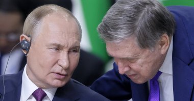 Russian President Vladimir Putin speaks with his aide Yuri Ushakov at the BRICS summit in Kazan, Russia, Oct. 24, 2024. (EPA Photo)