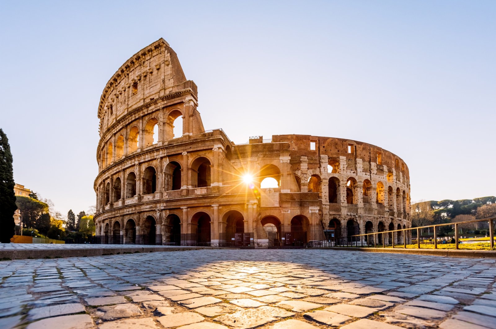 Sunlight streams through the arches of the Colosseum at sunrise, Rome, Italy, April 8, 2024. (Getty Images)