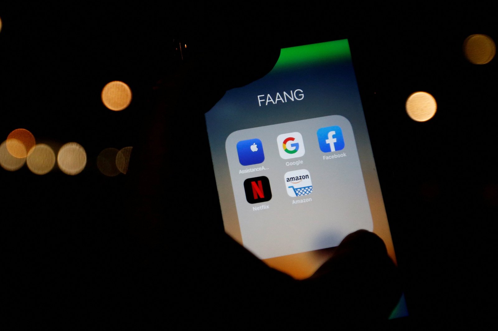 The logos of mobile apps, Google, Amazon, Facebook, Apple and Netflix, are displayed on a screen in this illustration picture taken on Dec. 3, 2019. (Reuters Photo)