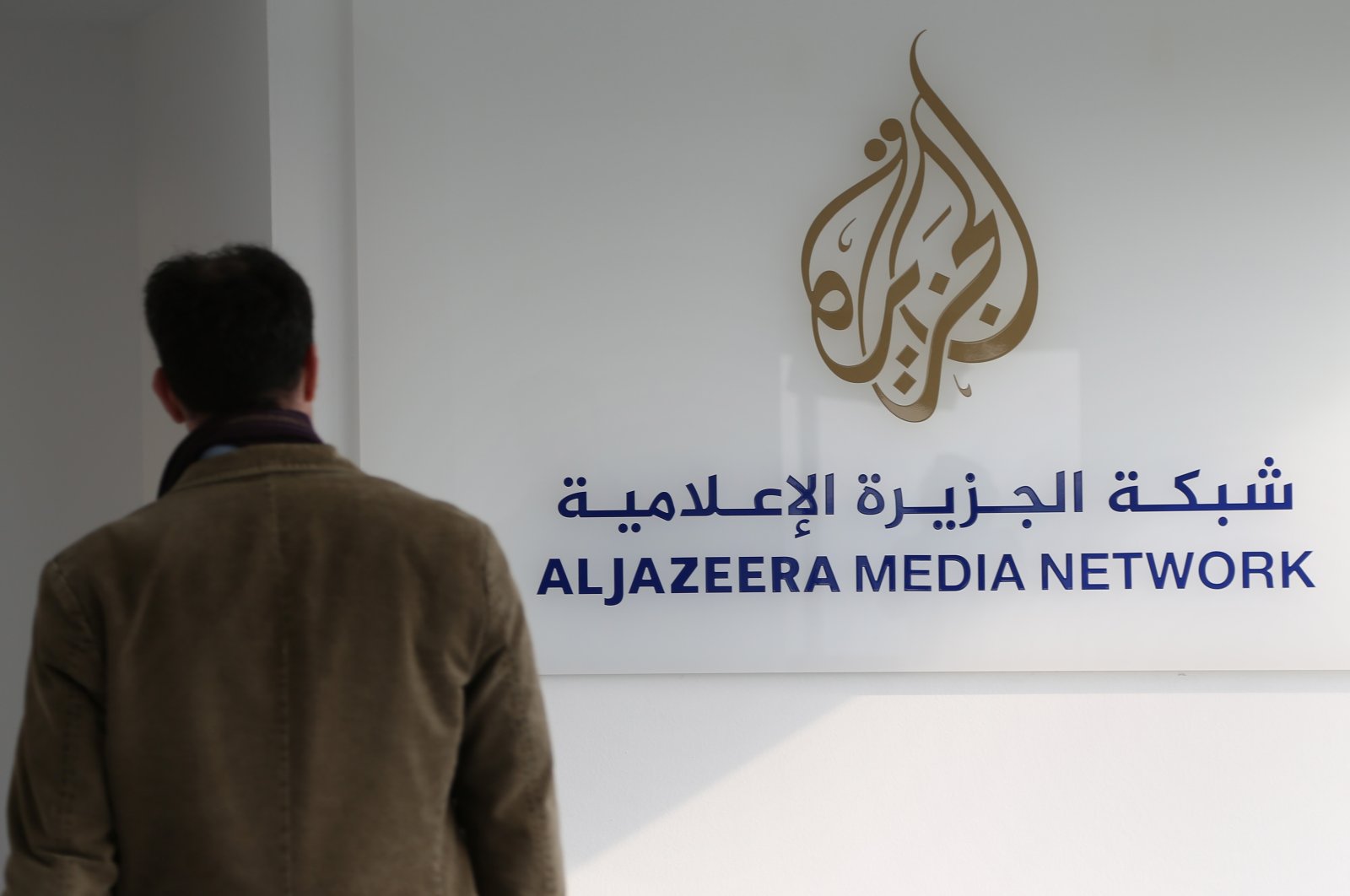 A journalist enters the Al Jazeera bureau in Berlin, Germany, Feb. 27, 2014. (Getty Images)