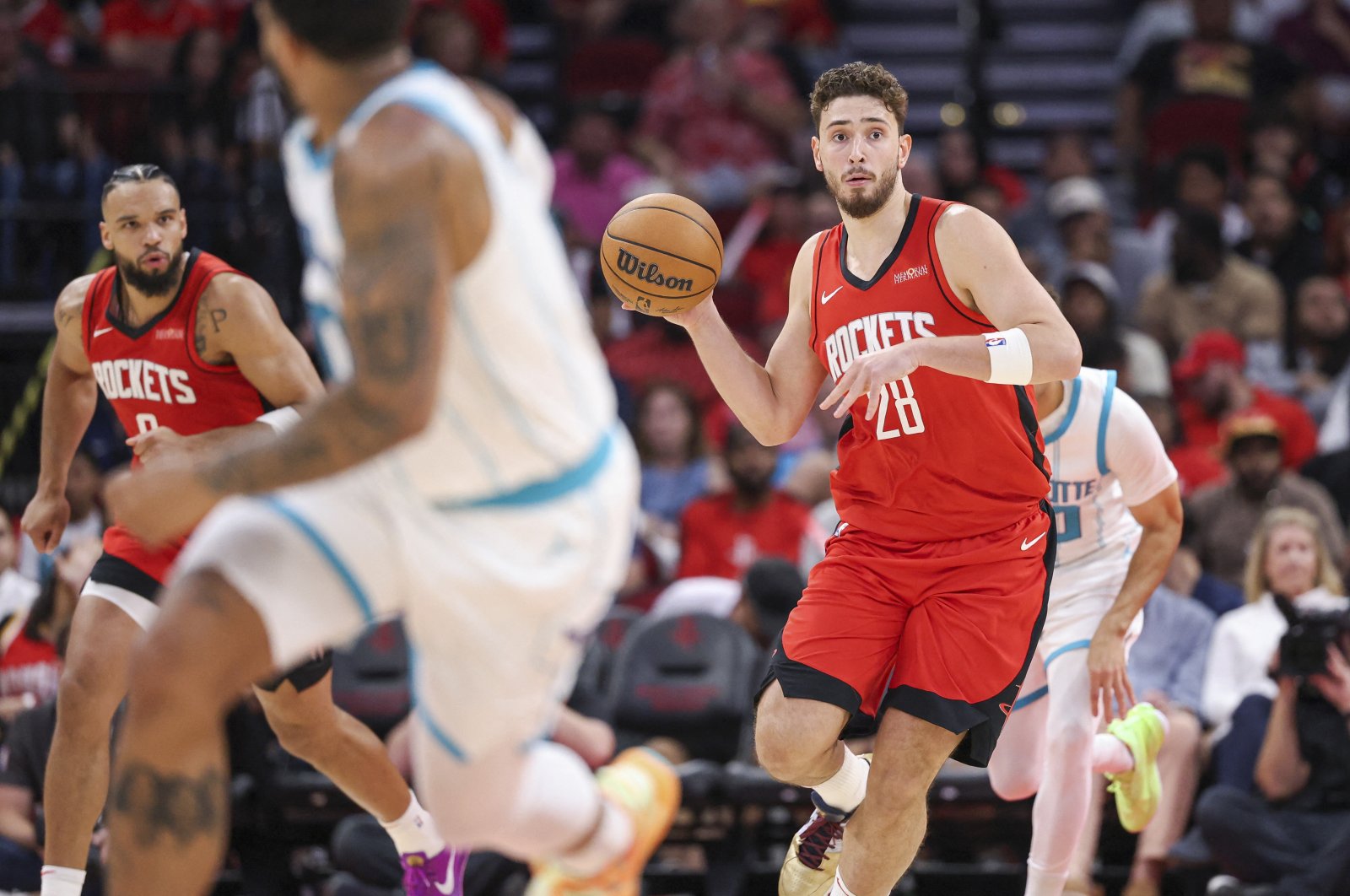 Houston Rockets center Alperen Şengün (R) drives with the ball after a rebound during the second quarter against the Charlotte Hornets at Toyota Center, Houston, Texas, U.S., Oct 23, 2024. (Reuters Photo)