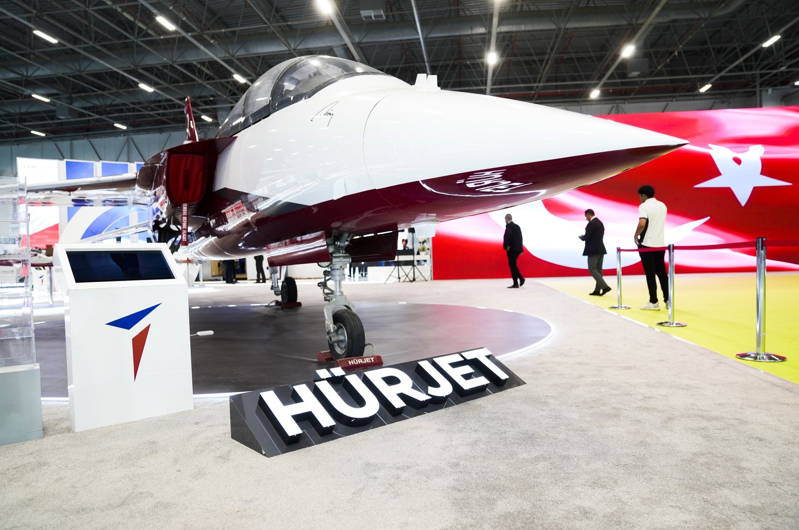 A Turkish flag is reflected on a screen after the PKK attack in Ankara, at the stand of TAI where the company&#039;s Hürjet is being exhibited at a defense fair, Istanbul, Türkiye, Oct. 24, 2024. (AA Photo)