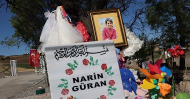 Narin&#039;s grave adorned with her photo and flowers, Diyarbakır, Türkiye, Oct. 11, 2024. (IHA Photo) 
