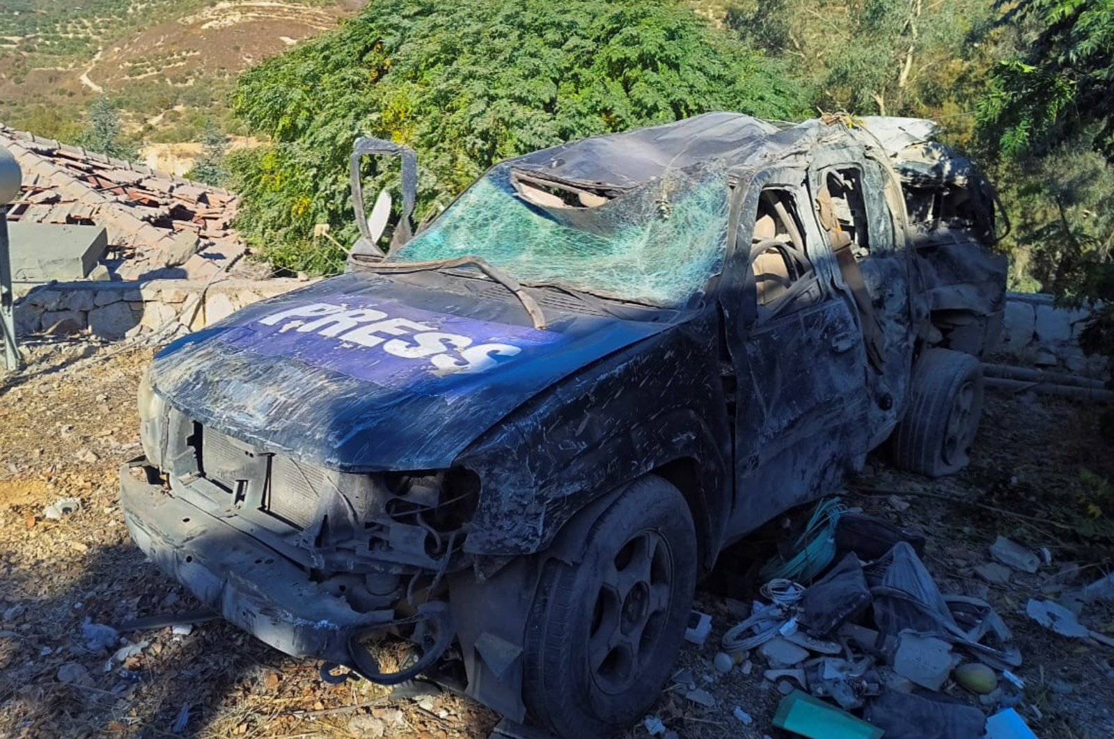 A view shows a damaged press vehicle at the site of an Israeli strike that killed a few media staff staying at a guesthouse where several other reporters were staying, Hasbaya, Lebanon, Oct. 25, 2024. (Reuters Photo)