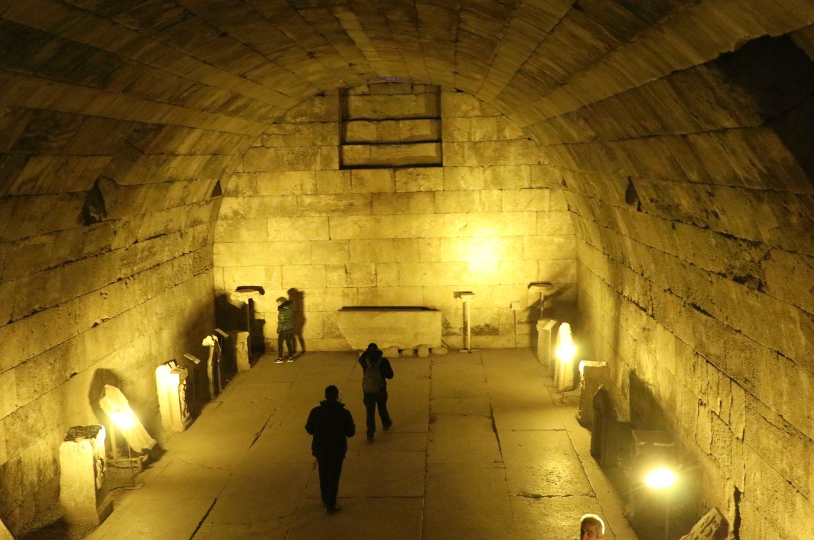 Visitors explore the ancient city of Aizanoi at night, illuminated by new lights, Kütahya, Türkiye, Oct. 23, 2024. (AA Photo)