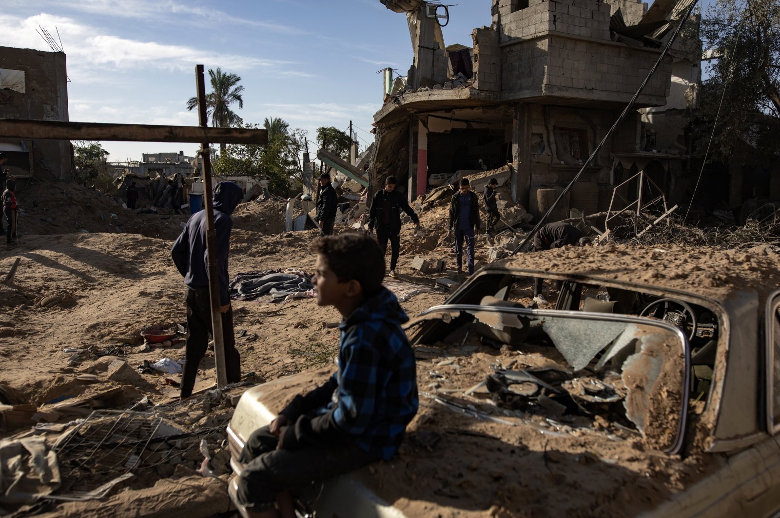 Palestinians inspect the remains of destroyed buildings following the Israeli airstrikes, Khan Younis, Gaza Strip, Palestine, Oct. 25, 2024. (EPA Photo)