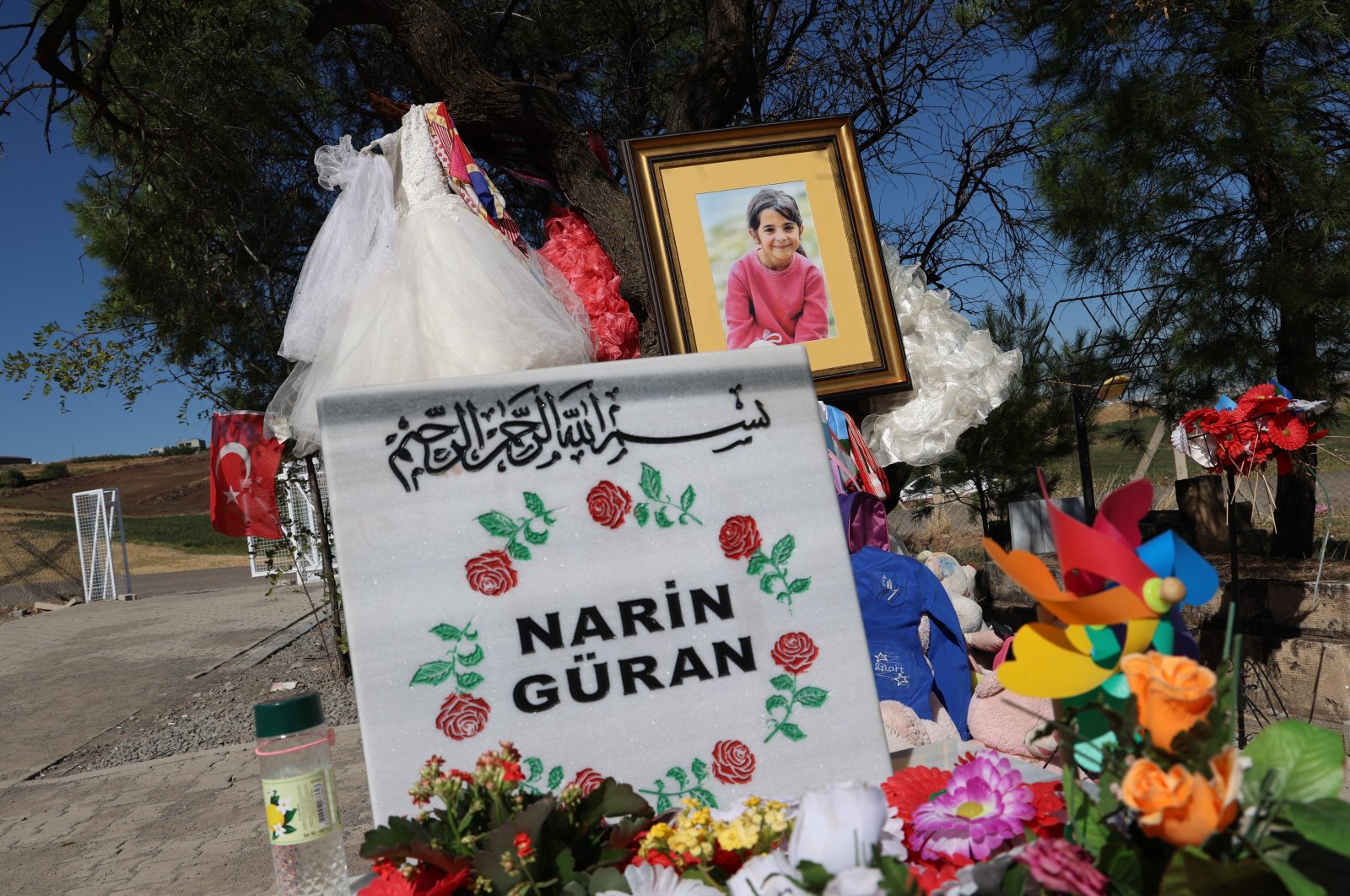 Narin&#039;s grave adorned with her photo and flowers, Diyarbakır, Türkiye, Oct. 11, 2024. (IHA Photo) 