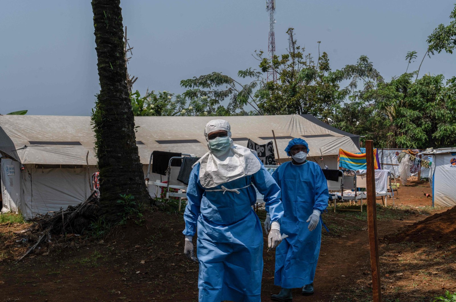 Two workers from the NGO Alima walk in the courtyard of the mpox treatment center, Kamituga, South Kivu, Democratic Republic of Congo, Sept. 20, 2024. (AFP Photo)