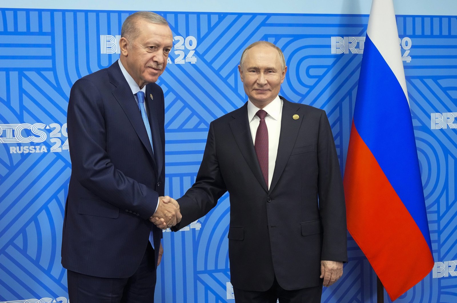 Russian President Vladimir Putin (R) welcomes President Recep Tayyip Erdoğan before their meeting on the sidelines of the BRICS summit, Kazan, Russia, Oct. 23, 2024. (EPA Photo)