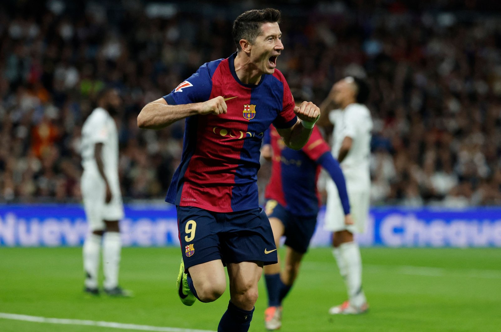 Barcelona&#039;s Robert Lewandowski celebrates scoring the opening goal during the match against Real Madrid at the Santiago Bernabeu stadium, Madrid, Spain, Oct. 26, 2024. (AFP Photo)