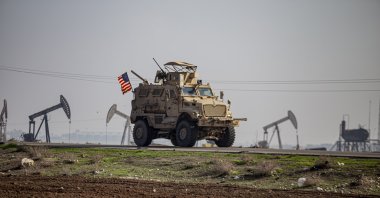A U.S. military vehicle is seen on a patrol in the countryside near the town of Qamishli controlled by the terrorist group YPG, Syria, Dec. 4, 2022. (AP Photo)
