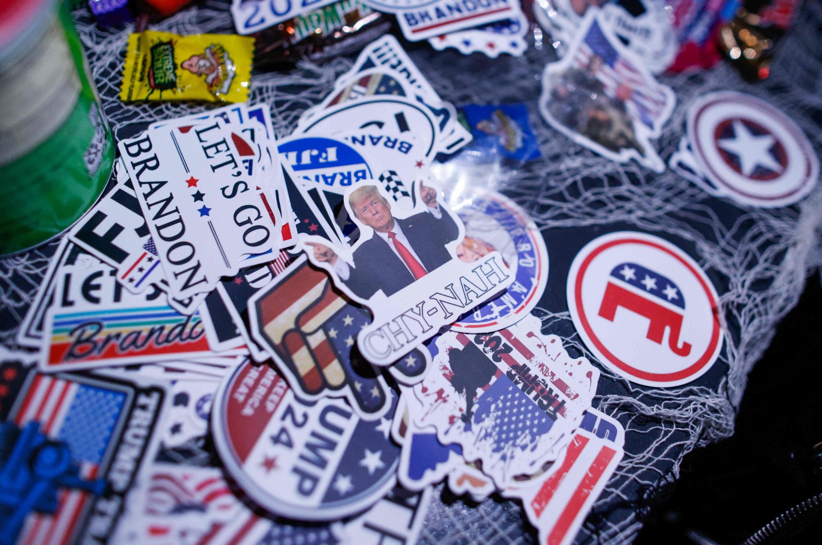 Pro-Trump stickers are placed on a table during the New York Young Republican Club&#039;s 6th annual rooftop MAGAWEEN party in New York, U.S., Oct. 26, 2024. (AFP Photo)