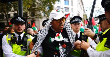 Police officers detain a demonstrator during a march to Downing Street organized by the Palestine Solidarity Campaign, London, Britain, Oct. 5, 2024. (EPA Photo)