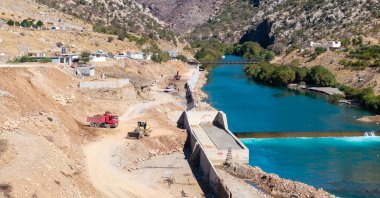 Bulldozers and trucks working on the coast of Great Zab in Sheladiz, Duhok, Iraq, Oct. 28, 2024. (AA Photo)