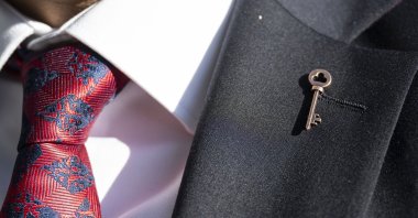 A member of the new party wears a key on his lapel as party members apply to the Interior Ministry in the capital of Ankara, Türkiye, Oct. 28, 2024. (AA Photo)