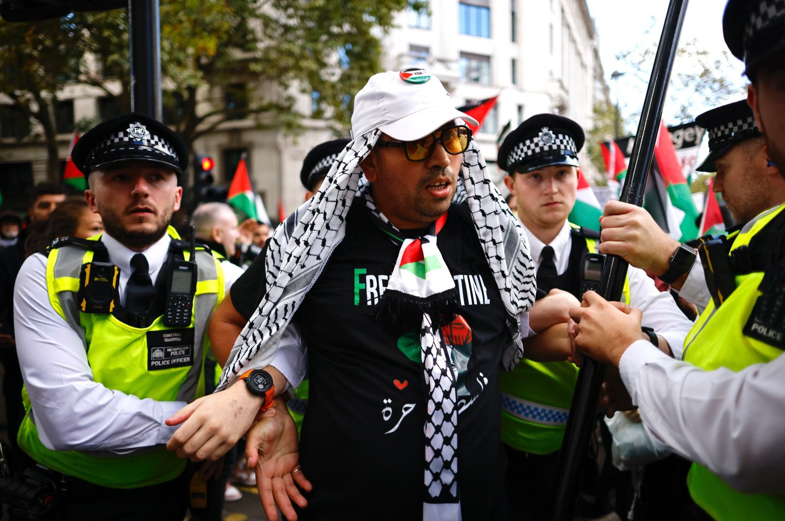 Police officers detain a demonstrator during a march to Downing Street organized by the Palestine Solidarity Campaign, London, Britain, Oct. 5, 2024. (EPA Photo)