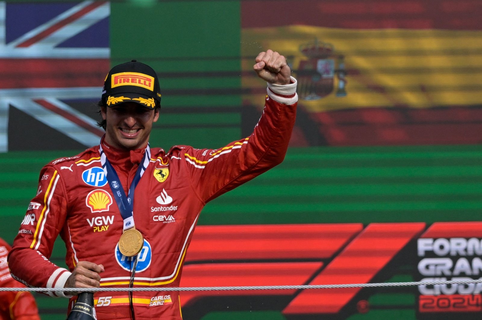 Ferrari&#039;s Spanish driver Carlos Sainz celebrates on the podium after winning the Mexico City Formula One Grand Prix at the Hermanos Rodriguez racetrack, Mexico City, Mexico, Oct. 27, 2024. (AFP Photo)