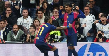 Barcelona&#039;s Lamine Yamal (R) celebrates scoring their third goal with teammate Raphinha during the La Liga match against Real Madrid at the Santiago Bernabeu stadium, Madrid, Spain, Oct. 26, 2024. (AFP Photo)