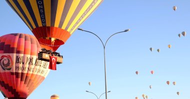 Hot air balloons adorned with Turkish flags fly across the sky in Cappadocia, Türkiye, Oct. 29, 2024. (AA Photo)