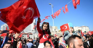 A girl celebrates while holding Türkiye&#039;s flag during the walk on Cumhuriyet Street, Kayseri, Türkiye, Oct. 29, 2024. (AA Photo)