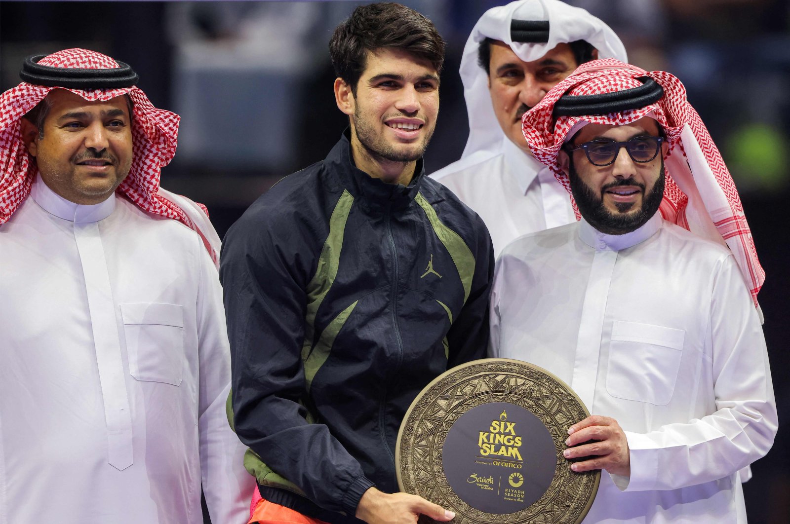 Spain&#039;s Carlos Alcaraz (C) poses for a picture with Saudi Arabia&#039;s General Entertainment Authority Chair Turki Al-Sheikh (R) after the final tennis match in the "6 Kings Slam" exhibition tournament, Riyadh, Saudi Arabia, Oct. 19, 2024. (AFP Photo)