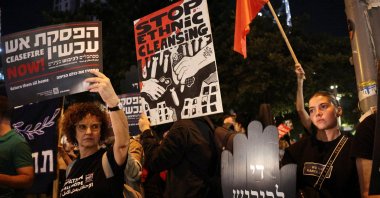 Israeli left-wing activists hold signs during a protest against Israel's actions in the Gaza Strip, Tel Aviv, Israel, Oct. 27, 2024. (Reuters Photo)