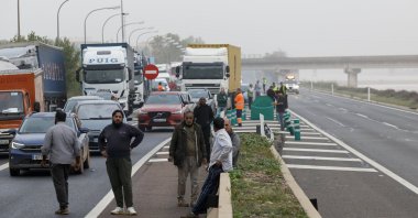 Traffic halted on a road near the Turia River as the road network remains blocked due to damage inflicted by significant rainfall, Valencia, Spain, Oct. 2024. (EPA Photo)