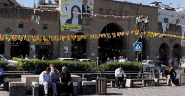 People sit on the benches, one day after Iraq's Kurdistan region parliamentary election, Irbil, Iraq, Oct. 21, 2024. (Reuters Photo)