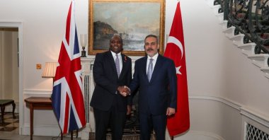 Foreign Minister Hakan Fidan, British Counterpart David Lammy shake hands after a meeting in London, U.K., Oct. 30, 2024. (IHA Photo)