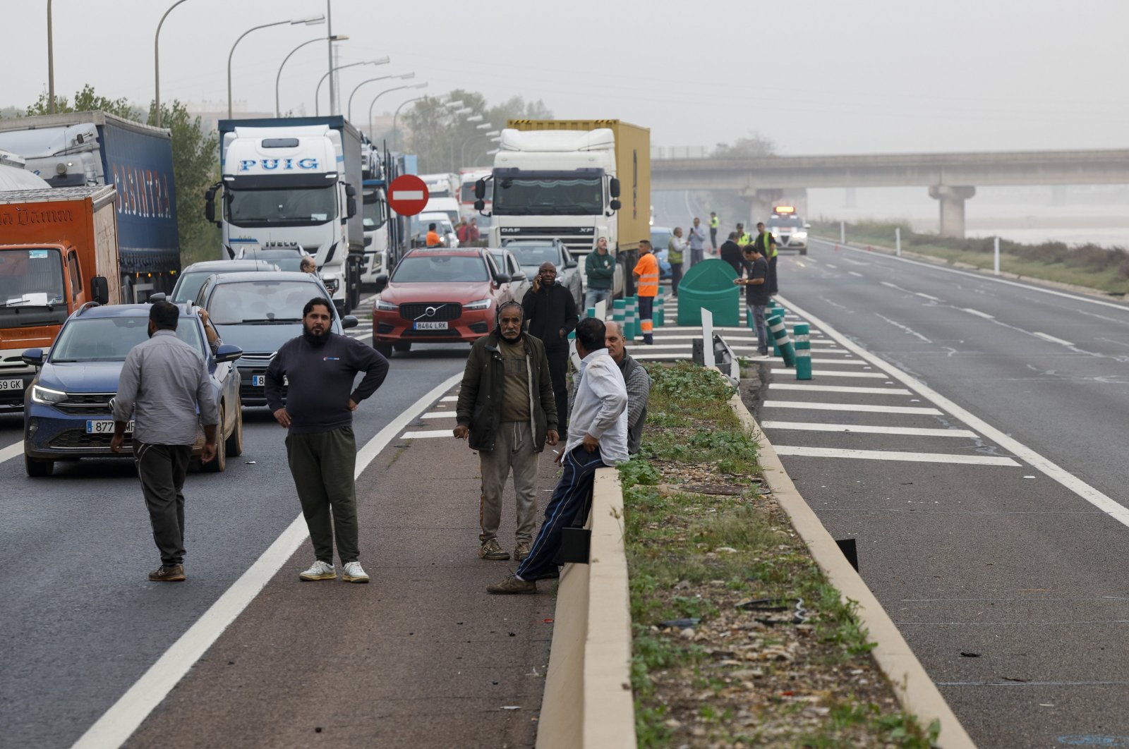 Traffic halted on a road near the Turia River as the road network remains blocked due to damage inflicted by significant rainfall, Valencia, Spain, Oct. 2024. (EPA Photo)