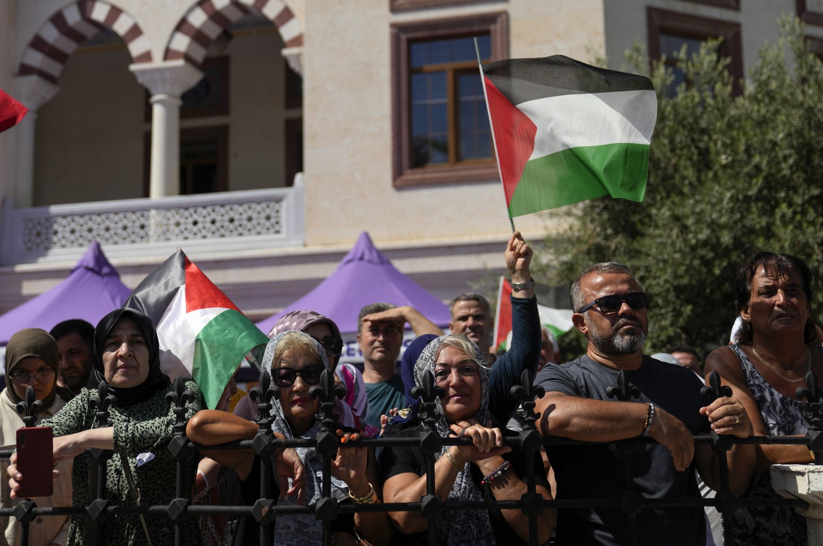 People hold Palestinian flags while attending the funeral of Ayşenur Ezgi Eygi, Aydın, western Türkiye, Sept. 14, 2024. (AP Photo)