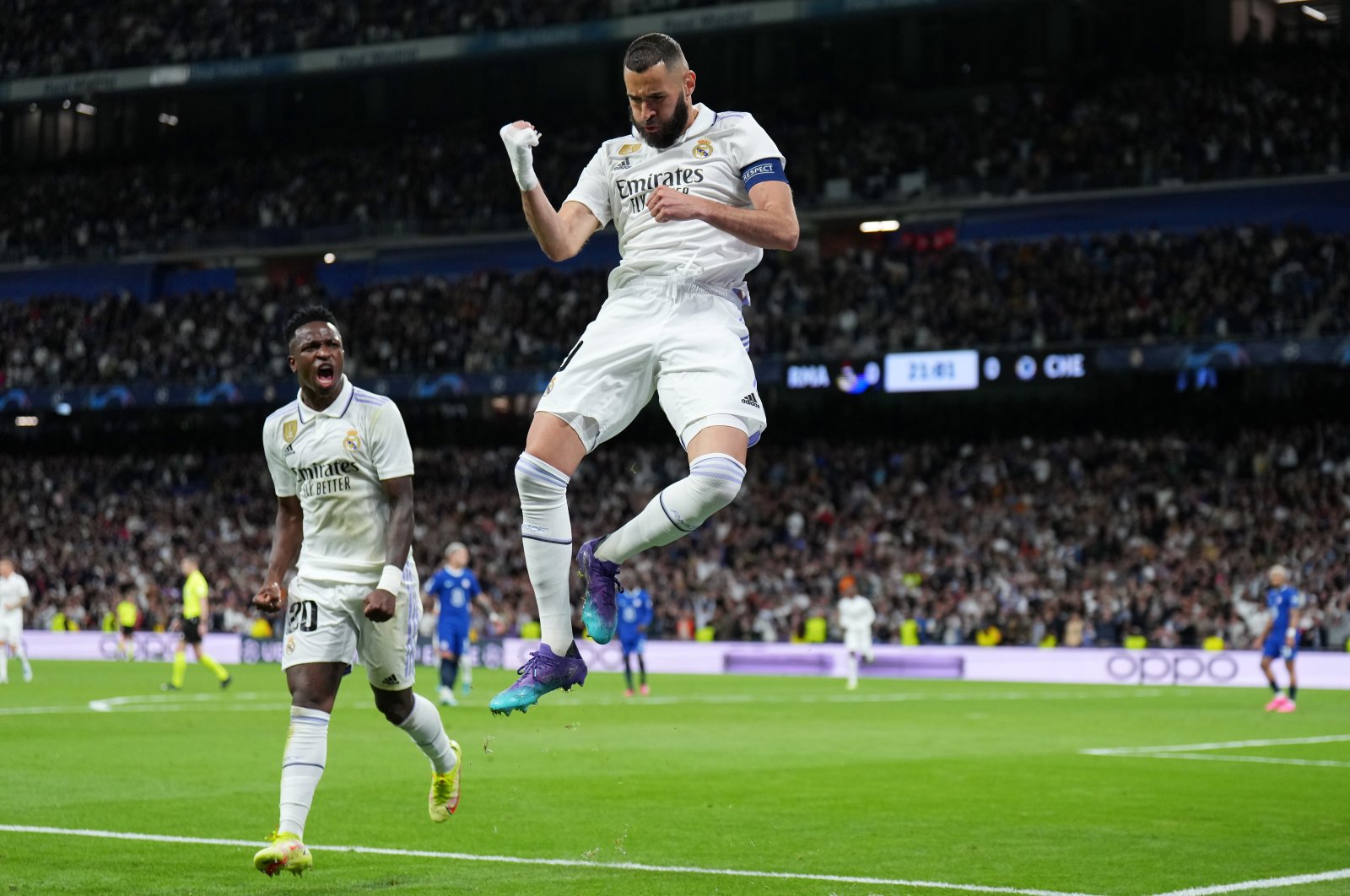 Karim Benzema (R) celebrates after scoring the team&#039;s first goal with teammate Vinicius Junior during the UEFA Champions League quarterfinal first leg match between Real Madrid and Chelsea, Madrid, Spain, April 12, 2023. (Getty Images Photo)