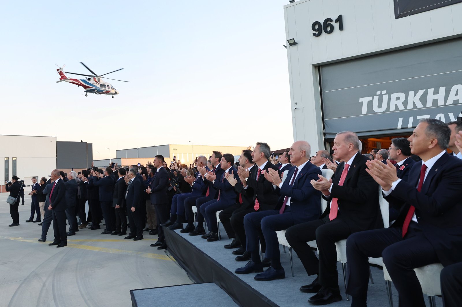 President Recep Tayyip Erdoğan watches as the multirole utility helicopter T625 Gökbey flies over the headquarters of the Turkish Aerospace Industries (TAI), Ankara, Türkiye, Oct. 29, 2024. (AA Photo)