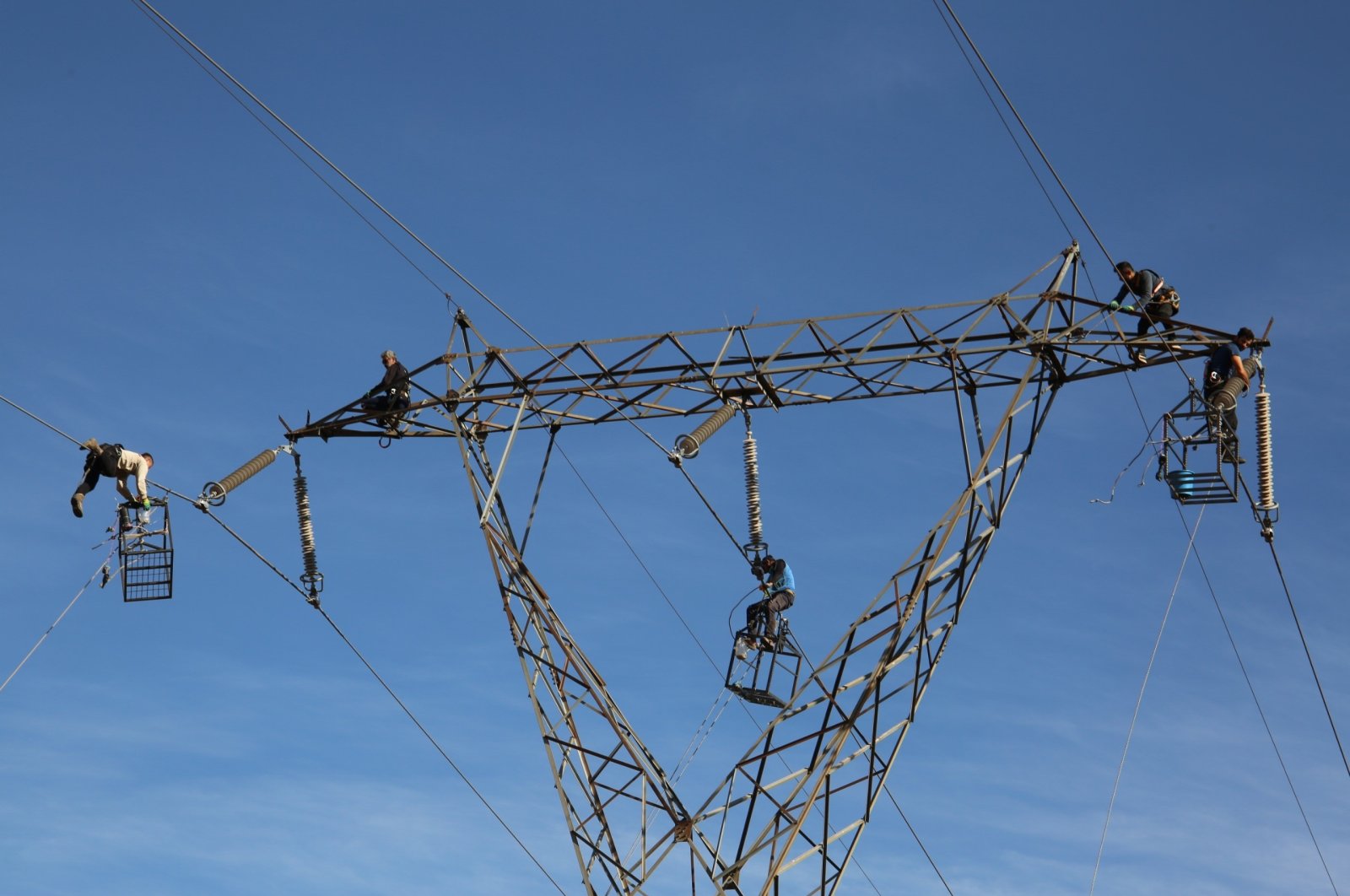 Workers inspect an electric grid in Muş province, eastern Türkiye, Oct. 19, 2024. (IHA Photo)