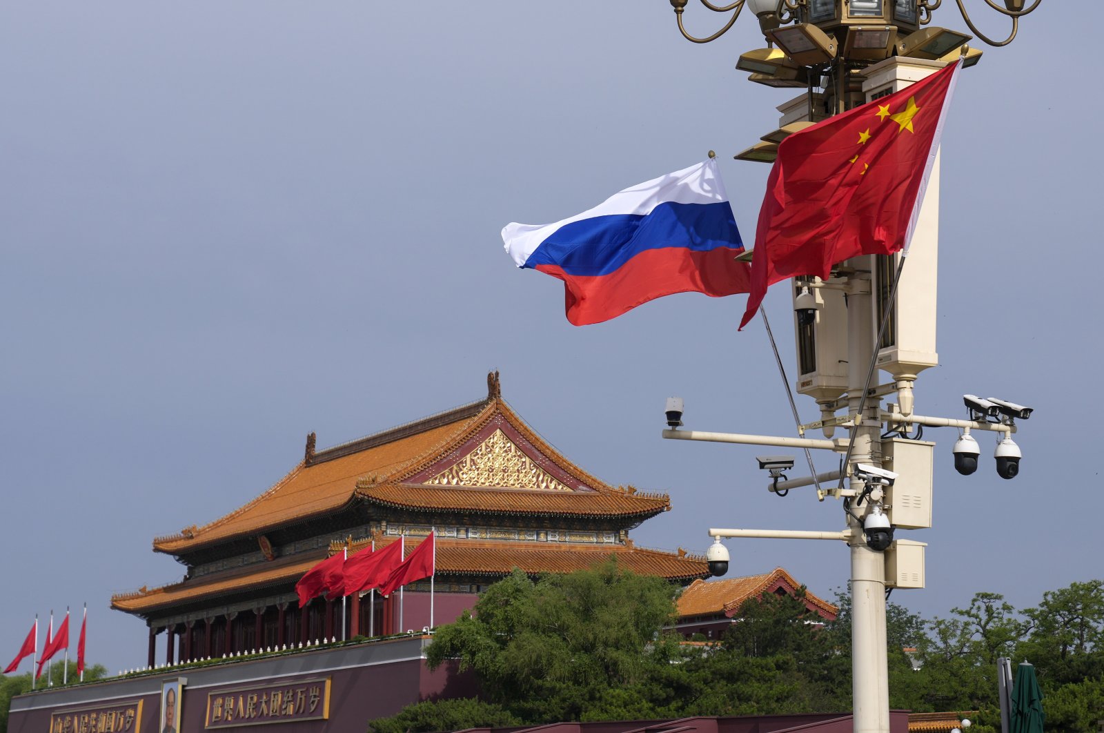 A Russian and Chinese national flag flutter near Tiananmen Gate, in Beijing, China, May 16, 2024. (AP Photo)